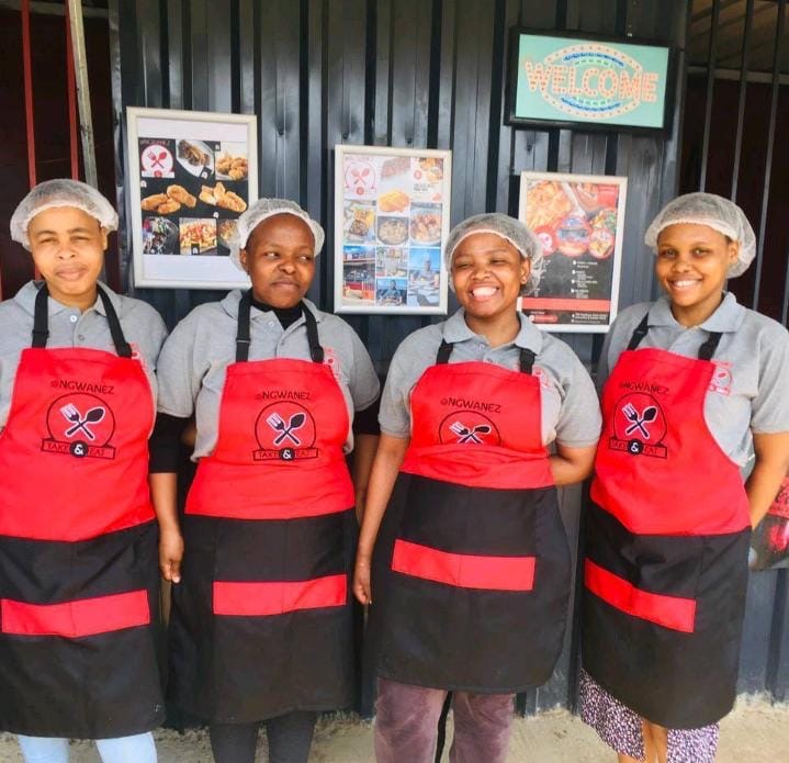 Crew wearing Ngwanez Take & Eat aprons and uniforms